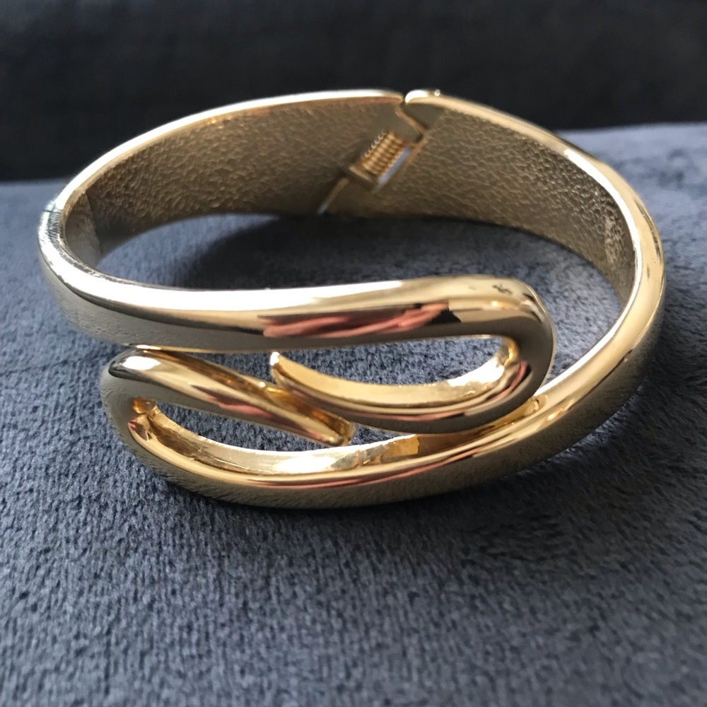 Gold toned hinged cuff bracelet